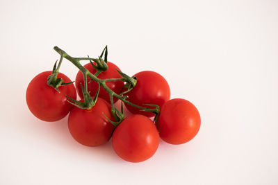 Close-up of cherry tomatoes against white background