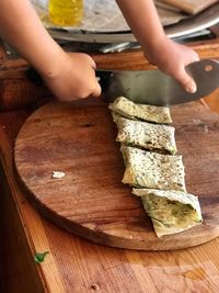 Close-up of man preparing food on table