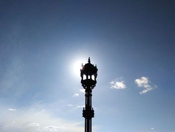 Low angle view of street light against sky