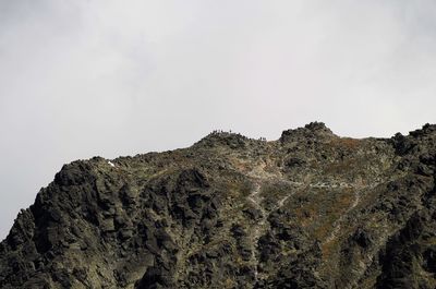 Low angle view of rock formations against sky
