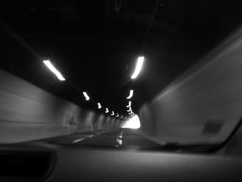 Man in illuminated tunnel