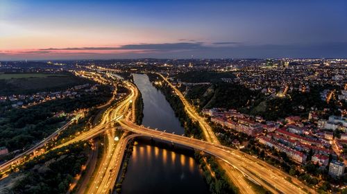 High angle view of light trails on highway in city at night