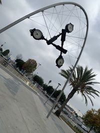 Low angle view of ferris wheel against sky