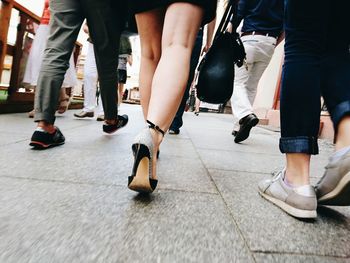 Low section of people walking on stage