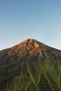 Scenic view of volcanic mountain against clear sky
