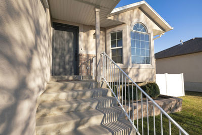 Exterior of house by building against sky