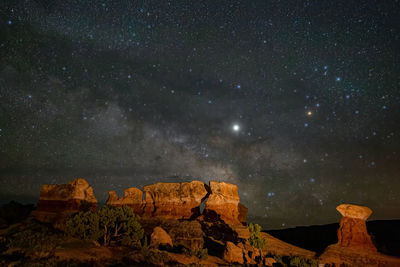 Low angle view of rock formation against sky