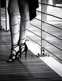 Low section of woman standing on tiled floor