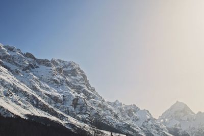 Scenic view of snowcapped mountains against clear sky