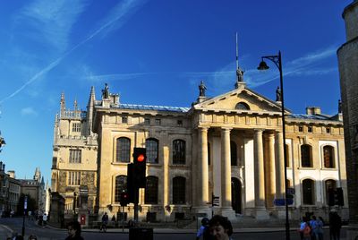 People in front of historic building