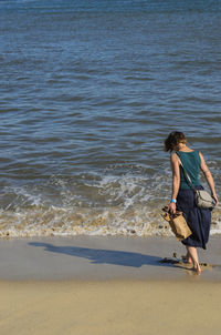 Woman walking on beach