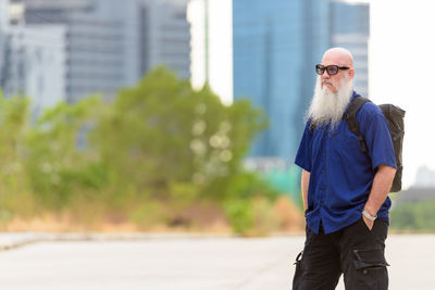 Man wearing sunglasses standing outdoors