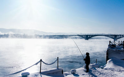 Scenic view of bridge over river during winter