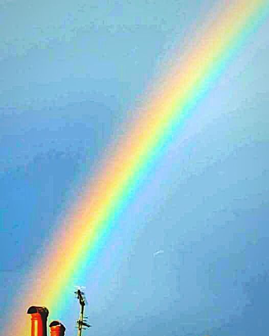 RAINBOW AGAINST SKY