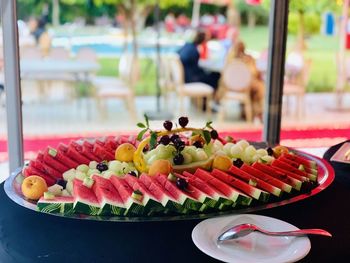 High angle view of fruits in plate on table