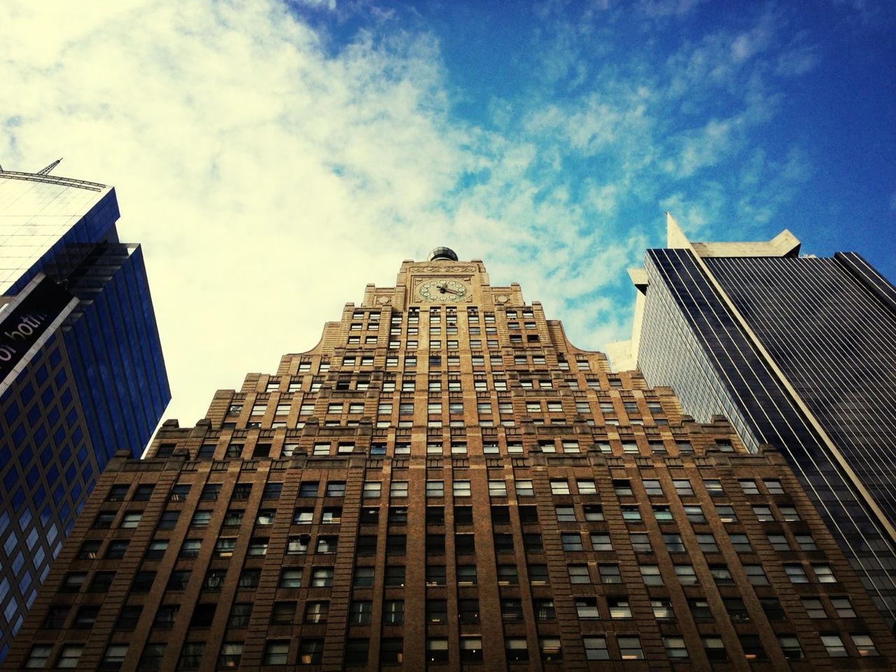 architecture, building exterior, low angle view, built structure, sky, city, modern, office building, skyscraper, tall - high, building, tower, window, day, outdoors, cloud - sky, blue, no people, architectural feature, glass - material