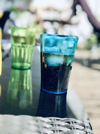 Close-up of coca cola in glass on table