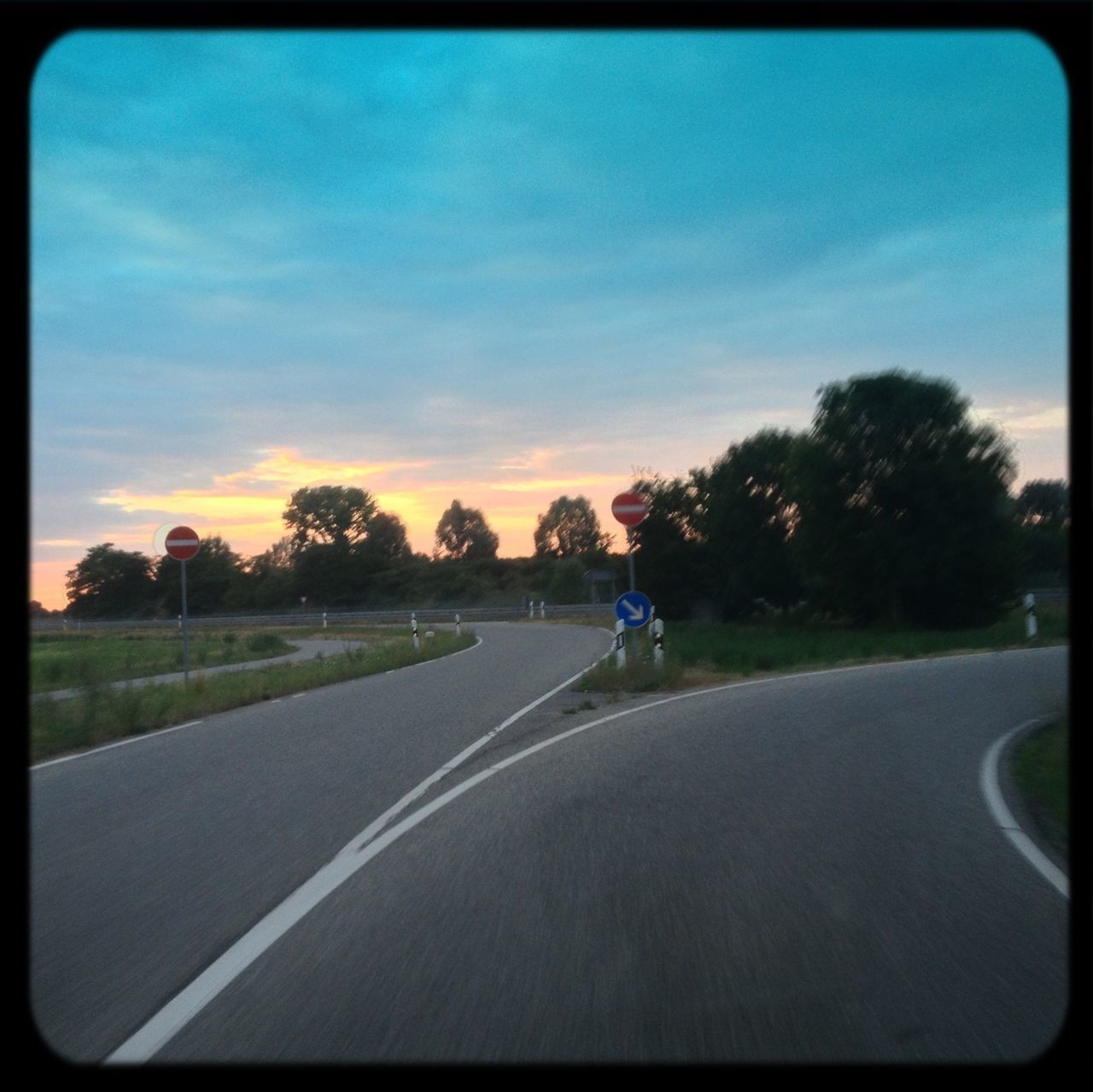 transportation, road, the way forward, transfer print, road marking, sky, tree, diminishing perspective, country road, auto post production filter, cloud - sky, street, cloud, sunset, car, vanishing point, empty, land vehicle, landscape, road sign