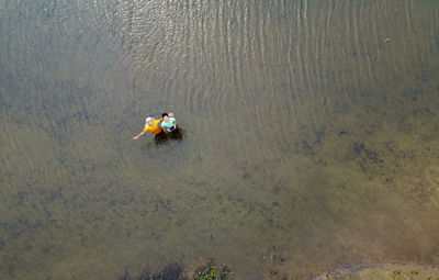 High angle view of people on lake 