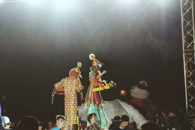 Low angle view of people at music concert