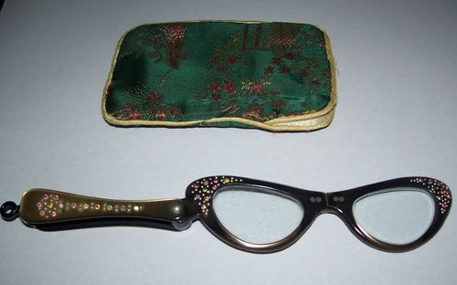 Close-up of sunglasses on table against white background