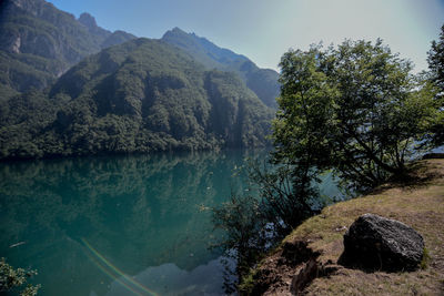 Scenic view of lake and mountains against sky