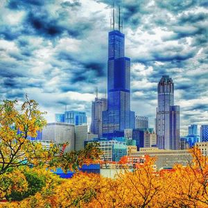 Low angle view of buildings against cloudy sky