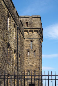 Low angle view of old building against sky