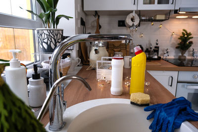 Cropped hand washing hands in bathroom