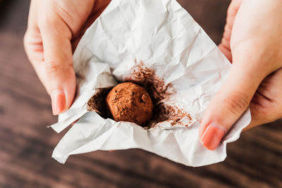 Midsection of woman holding ice cream