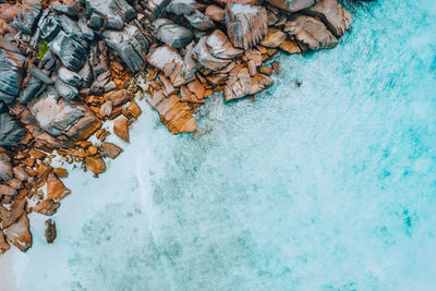 High angle view of rocks by sea