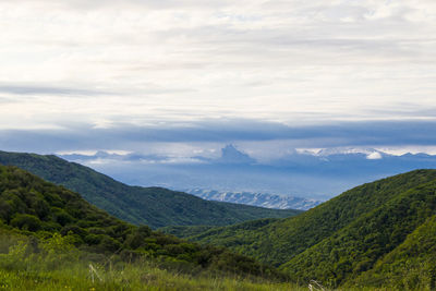 Mountain landscape in georgia. landscape from didgori road. clouds and blue sky.