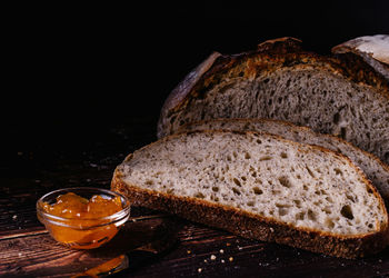 Close-up of food on table against black background