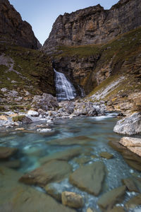 Scenic view of river flowing through rocks