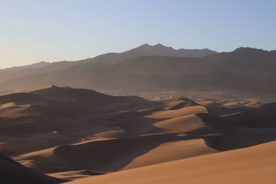 Scenic view of mountains against sky during sunset