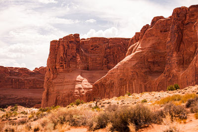 View of rock formations against cloudy sky