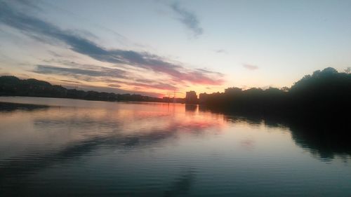 Scenic view of lake at sunset