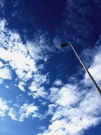 Low angle view of vapor trail in blue sky