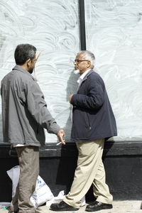 Men standing in store