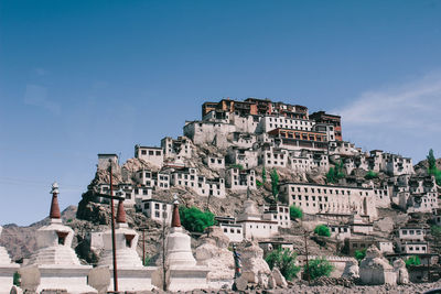 Low angle view of buildings against blue sky