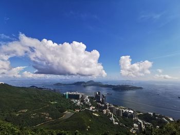 Panoramic view of sea and buildings against sky