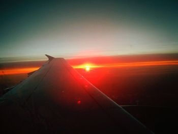 Cropped image of car at sunset