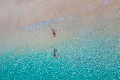 High angle view of man swimming in sea