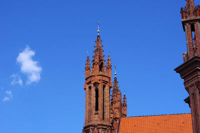 Low angle view of traditional building against blue sky