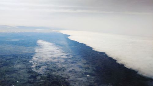 Aerial view of sea against sky
