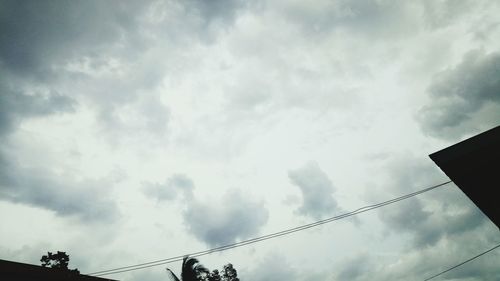 Low angle view of cables against sky