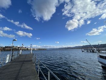 Pier over sea against sky