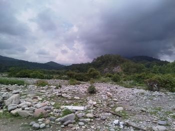 Surface level of stones against sky