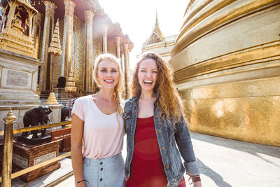 Happy women at temple in city