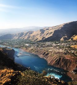 High angle view of aerial view of land and mountains against sky